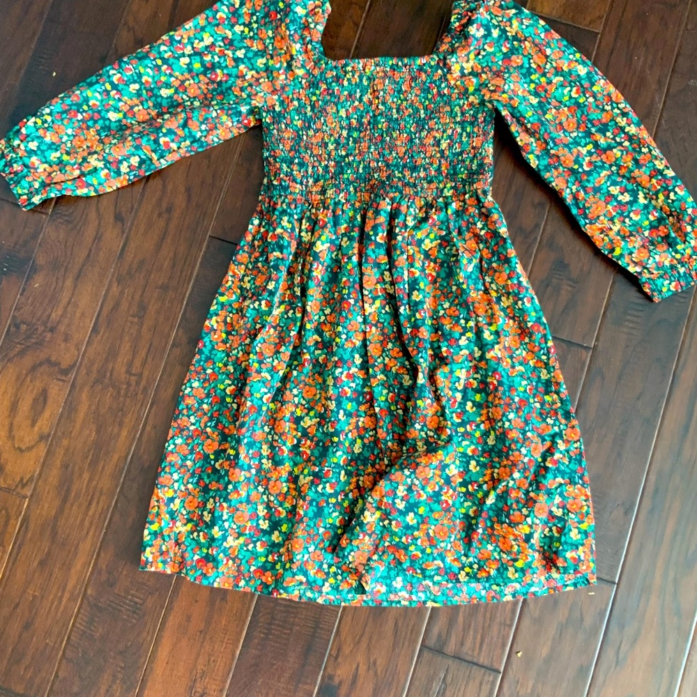 So sorry Sold! Bright floral dress, smocked on top flowy on the bottom!